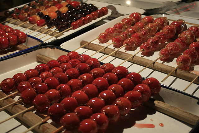 hawthorn ball kebabs displayed in front of a store