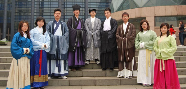 a group of people on a staircase wearing hanfu outfits