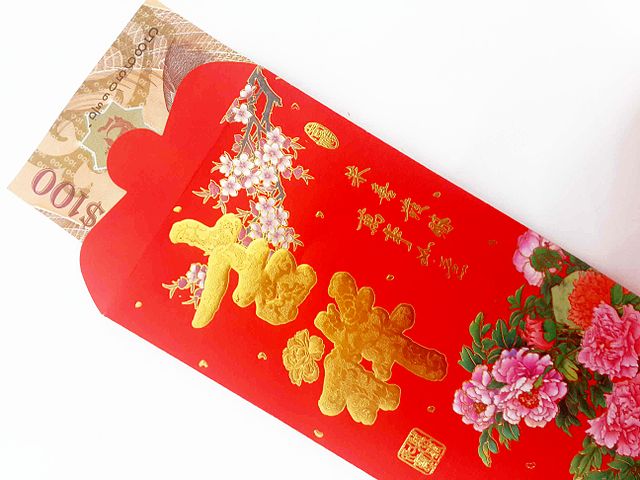 red pocket with luck money given as chinese new year greetings