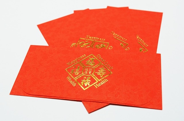a stack of four red pockets